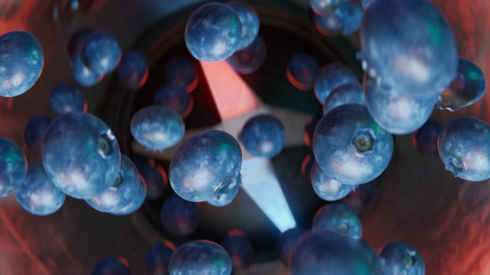Blueberries tumbling through a red tunnel